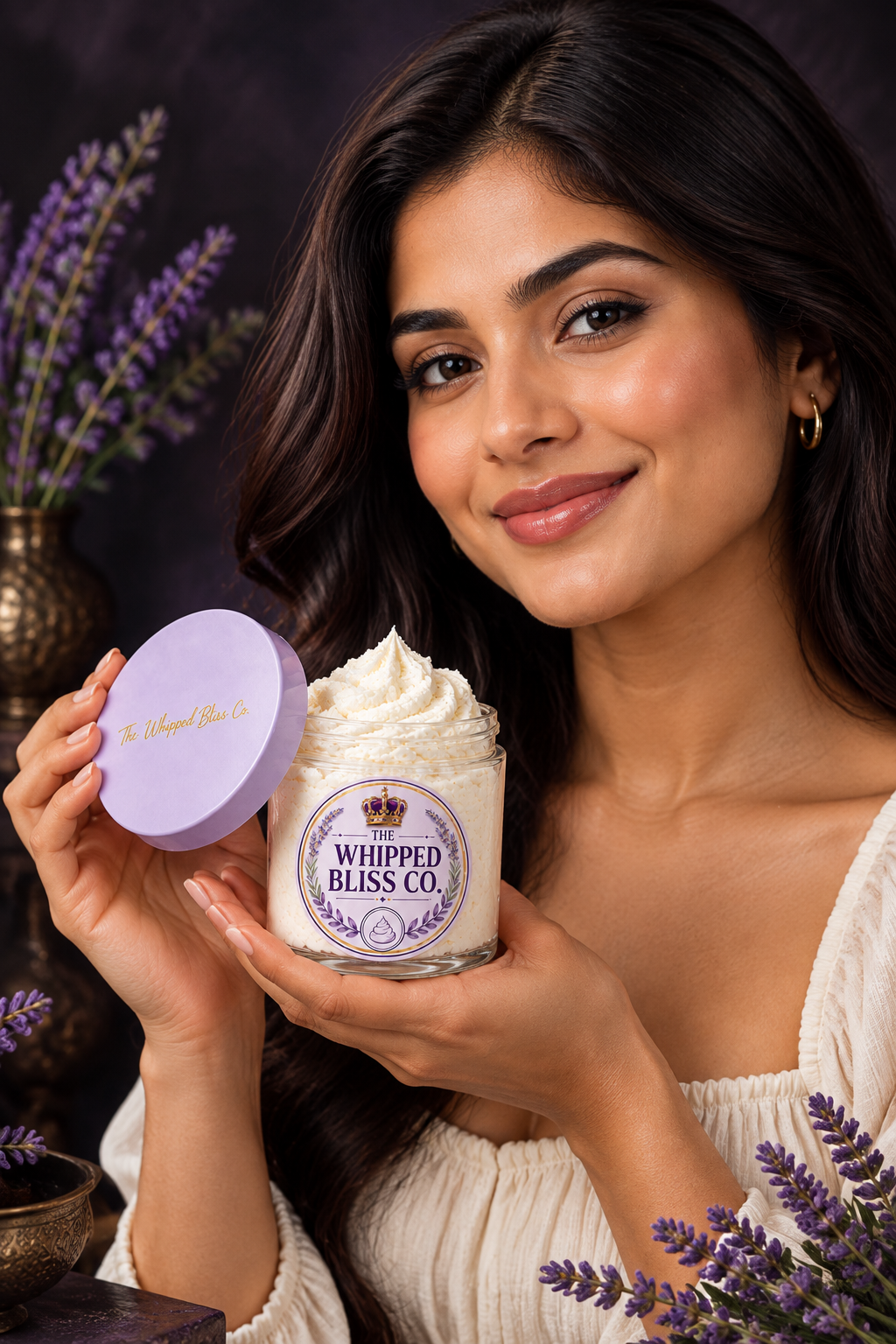Woman holding Black Amber and Lavender Body Butter jar for scale reference