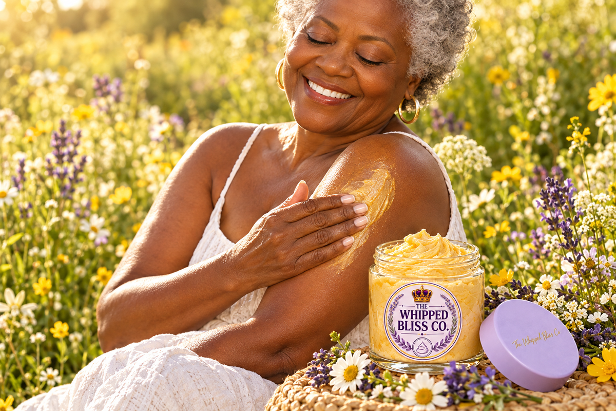 Woman applying Wildflower Honey Body Butter in a meadow
