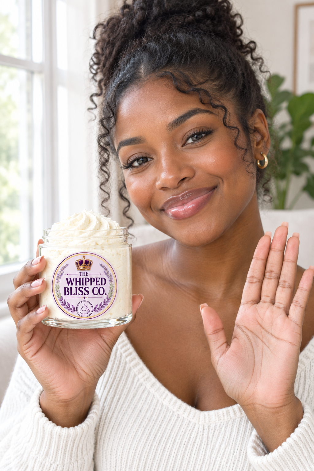 Young woman holding Sweet Pea Body Butter jar for scale reference