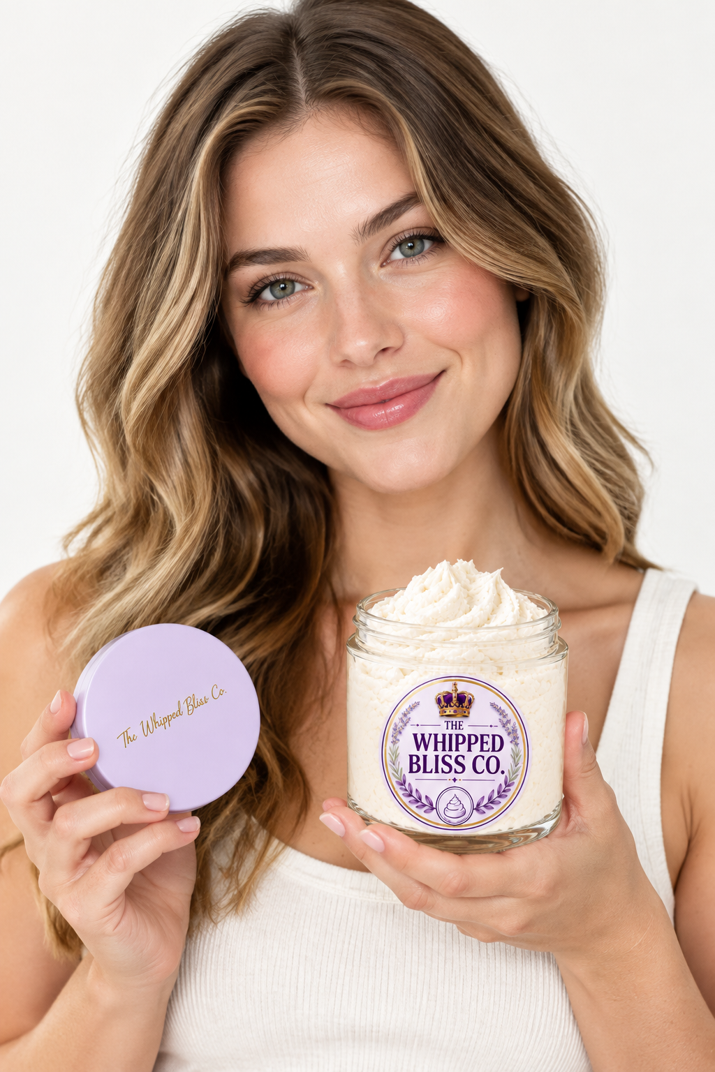 Woman holding Shea Body Butter jar for scale reference