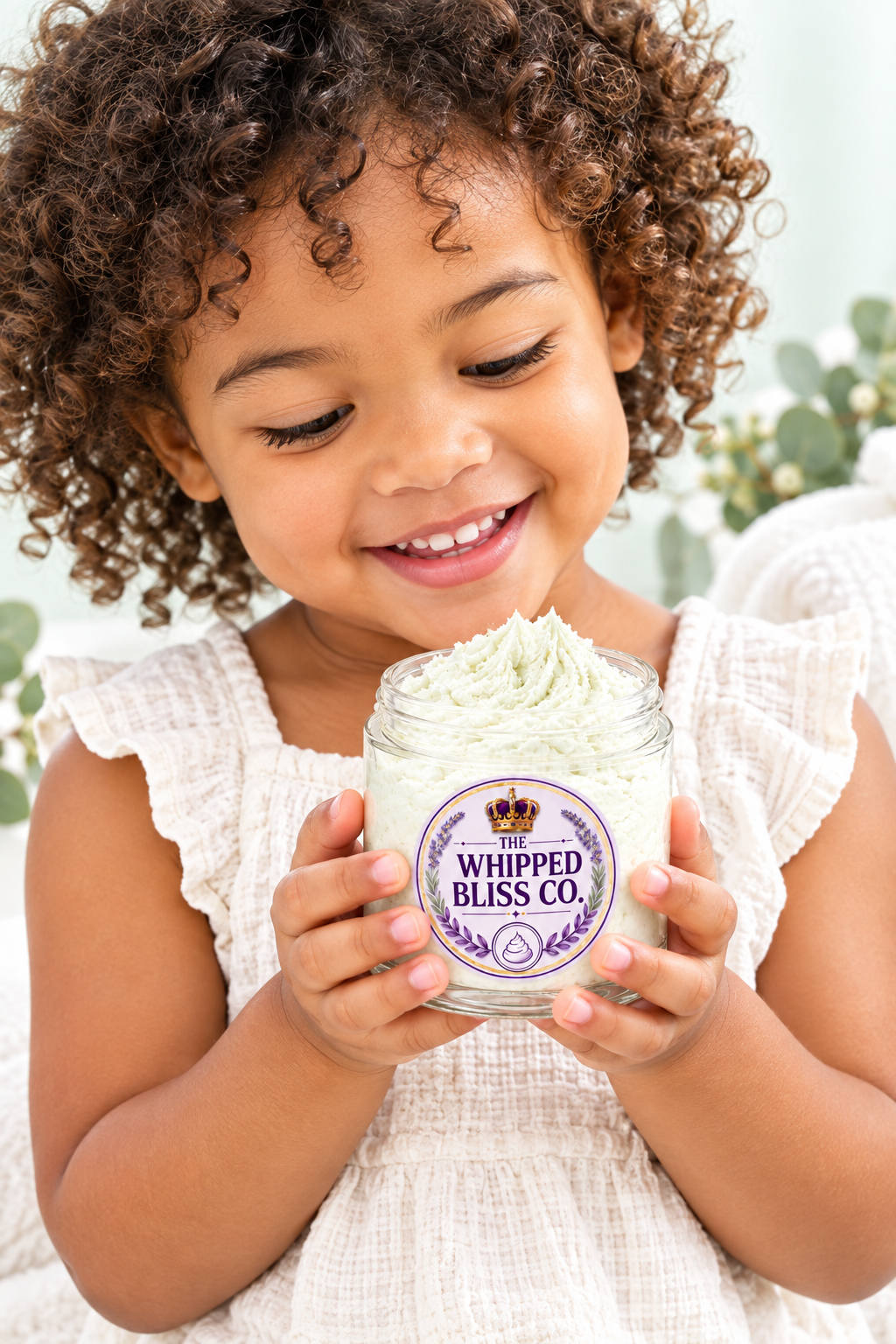 Child holding Eucalyptus Body Butter jar for scale reference