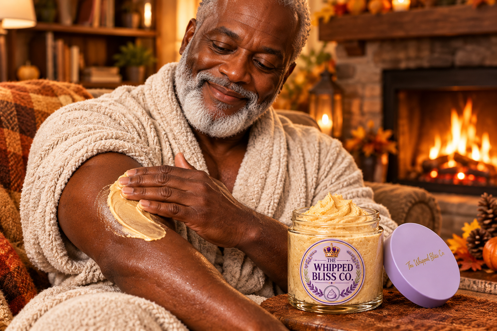 Man applying Roasted Hazelnut Body Butter by the fireplace
