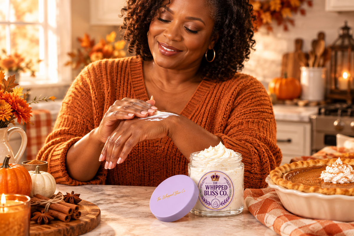 Woman applying Spiced Pumpkin Pie Body Butter in a cozy kitchen